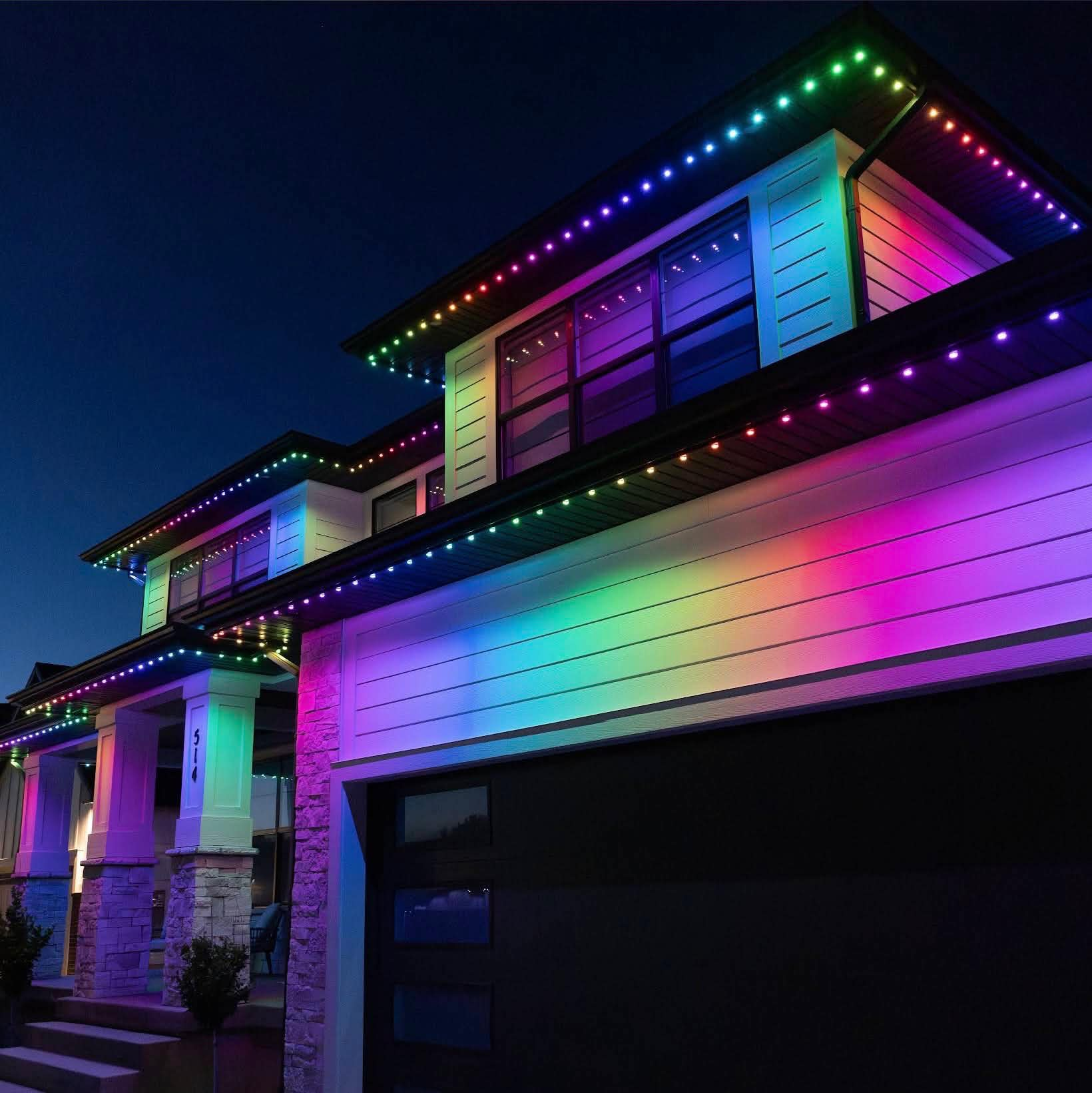Rainbow-colored permanent lights along a modern home's roofline